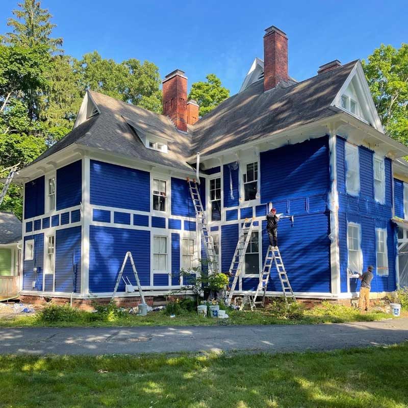 A house, newly painted blue