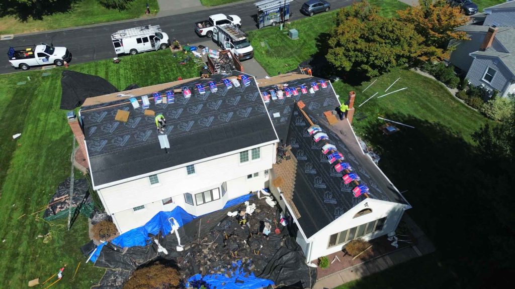 Drone shot of in-progress roof repair on Farmington Valley home