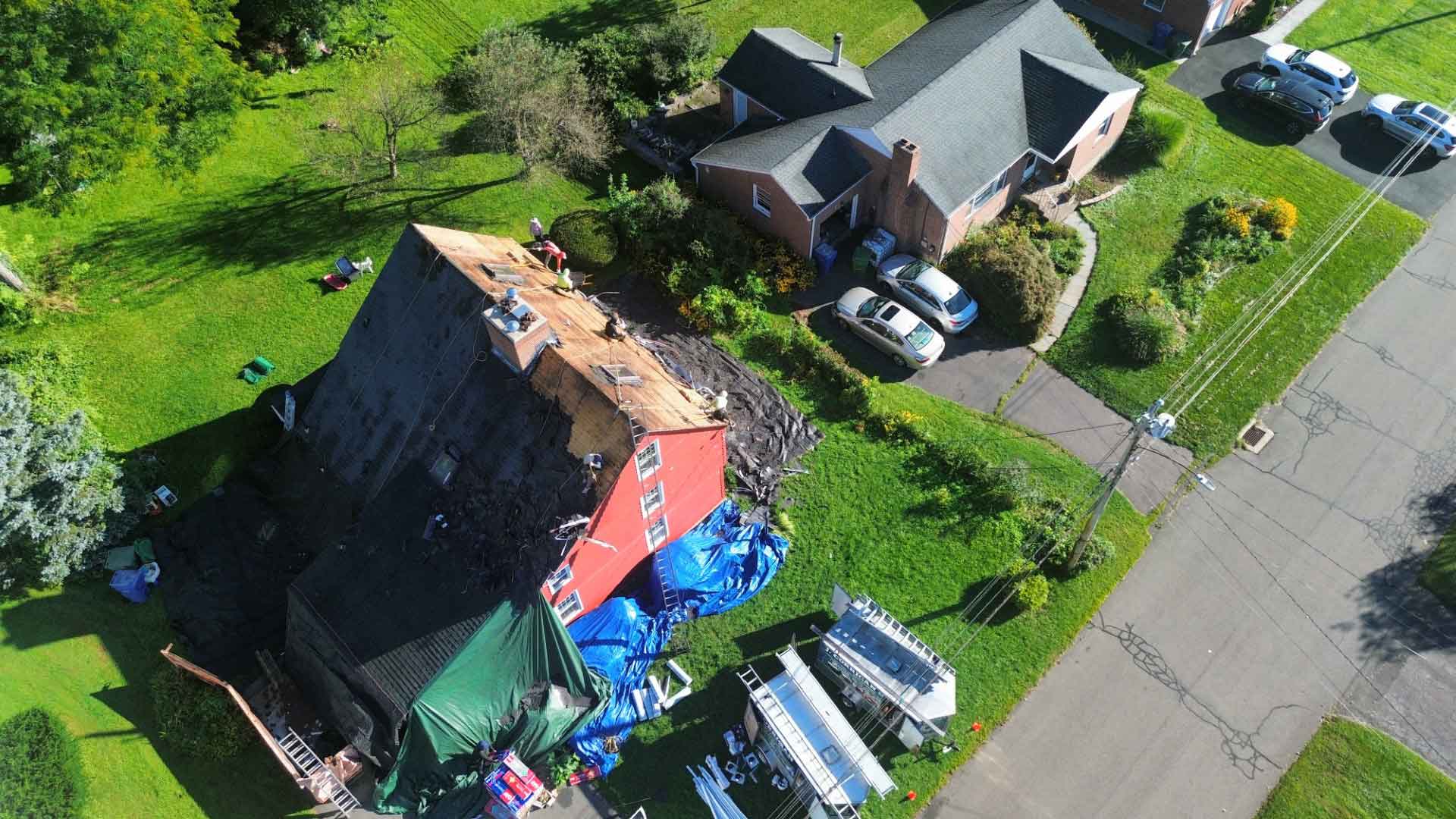 Drone shot of in-progress roof repair on Farmington Valley home